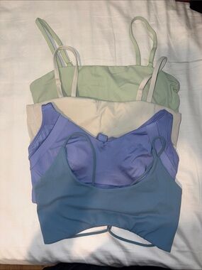 Assortment of non-name sports bras. size M. Blue, Lavender, Cream & Green